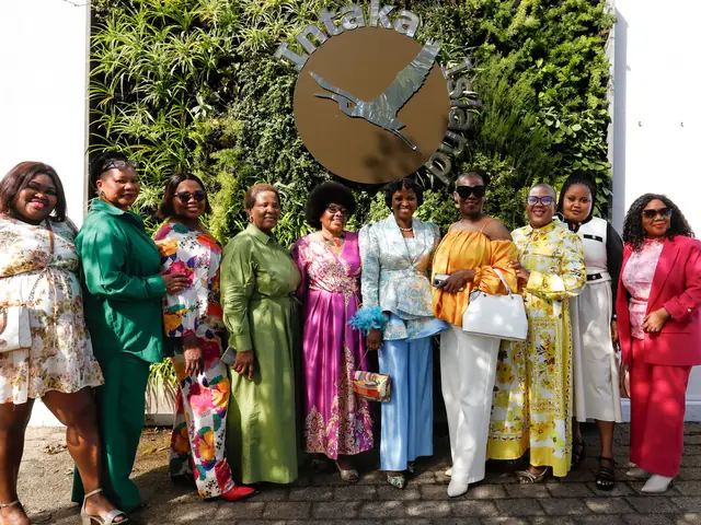 A group of women in bright, elegant outfits at an I AM FRUITFUL gathering