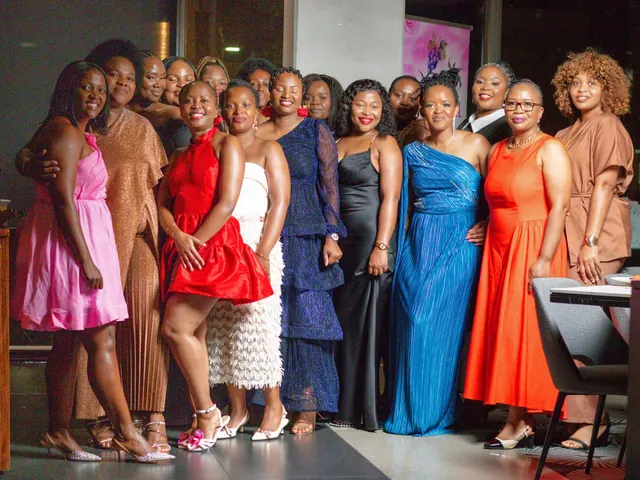 A group of women in evening dresses at a Galentine's dinner